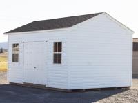 Custom Front Entry Peak Shed with White Vinyl Siding from Pine Creek Structures